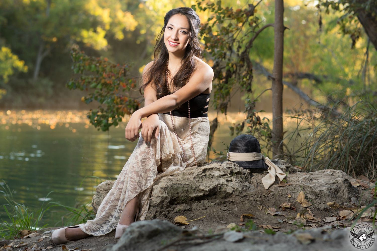 Gorgeous Austin senior portraits of high school senior gil in black and white dress with hair and makeup by Divaz Fabula on the hike and bike trail on Lady Bird Lake.