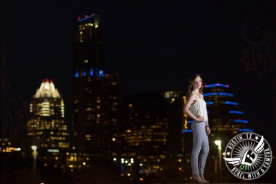 senior portraits with the austin skyline at night