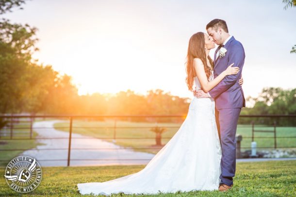 Lone Oak Barn wedding photos - bride and groom kiss in the sunset